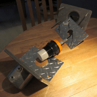 a custom bracket for mounting an ultrasonic sensor on a boom