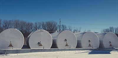 This row of fuel storage tanks could use a set of magnetostrictive probes for accurate level monitoring