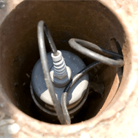 an ultrasonic sensor mounted inside a stilling well